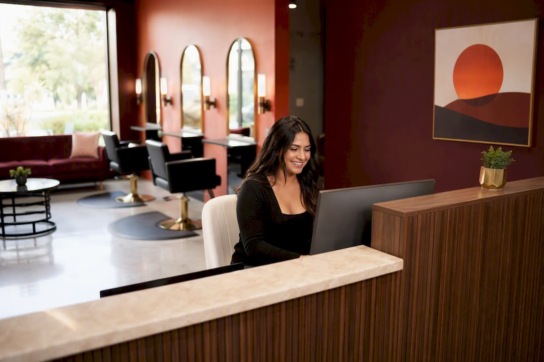 Salon reception showing dual market positioning