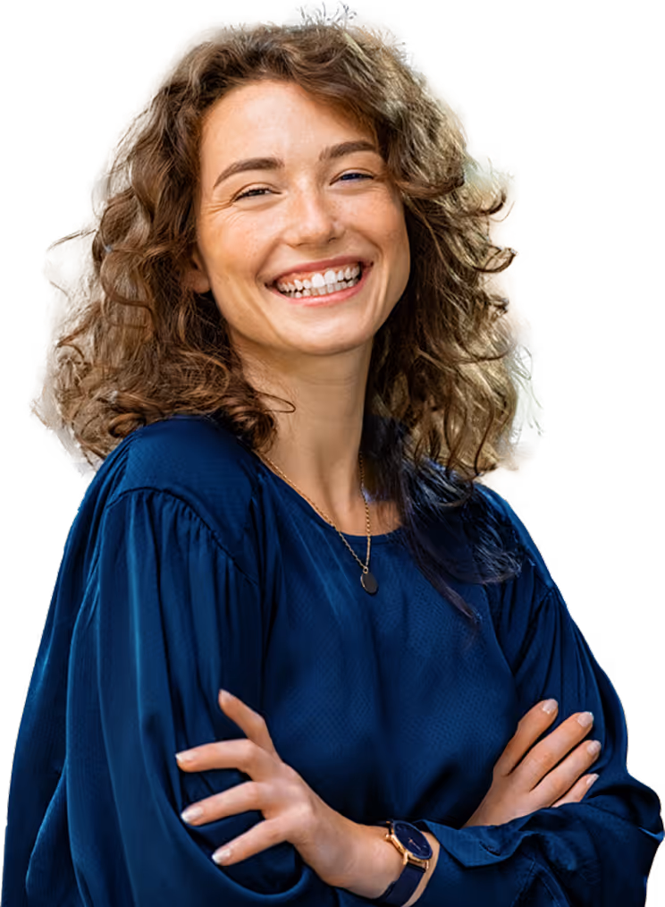 Smiling woman with curly hair wearing a navy blue blouse and watch, arms crossed.
