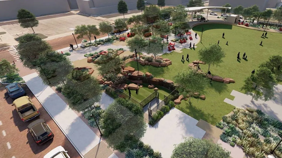 Aerial rendering of a park with a lawn, dog park, desert landscaping, and a street with parked cars.