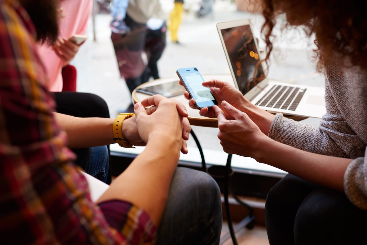 Two people viewing a smart phone together. Brightwell's new mobile app, Navigator, enables a global workforce to easily access and send funds from their smartphone.