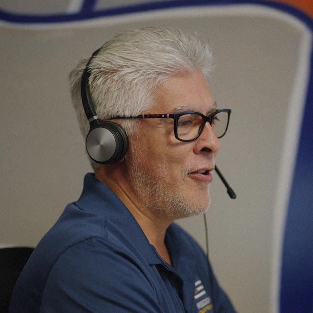 Freedom Power team member wearing a headset on a phone call