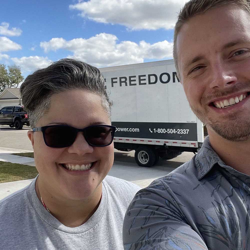 Selfie image of Freedom Power Rep with a customer