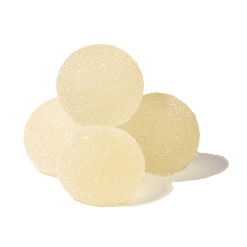 Four translucent white gummy or Grön Lychee Limeade Pearls spheres with a sugar coating.