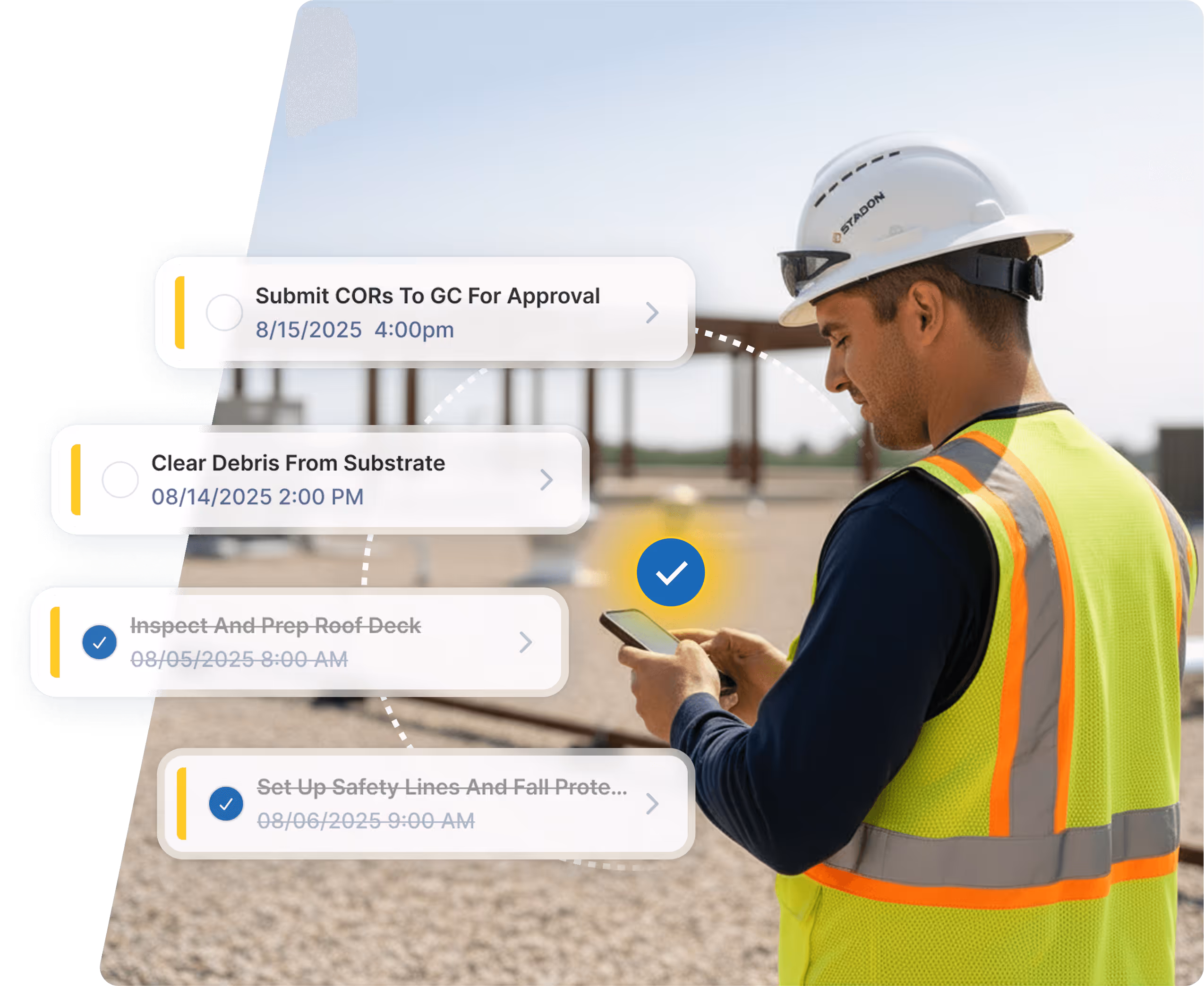 Construction worker in yellow safety vest and white hard hat checking task list with scheduled jobs on a smartphone at a construction site.