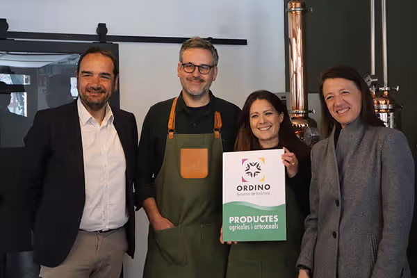 photo of john and soraya with some government officials in front of their gin still