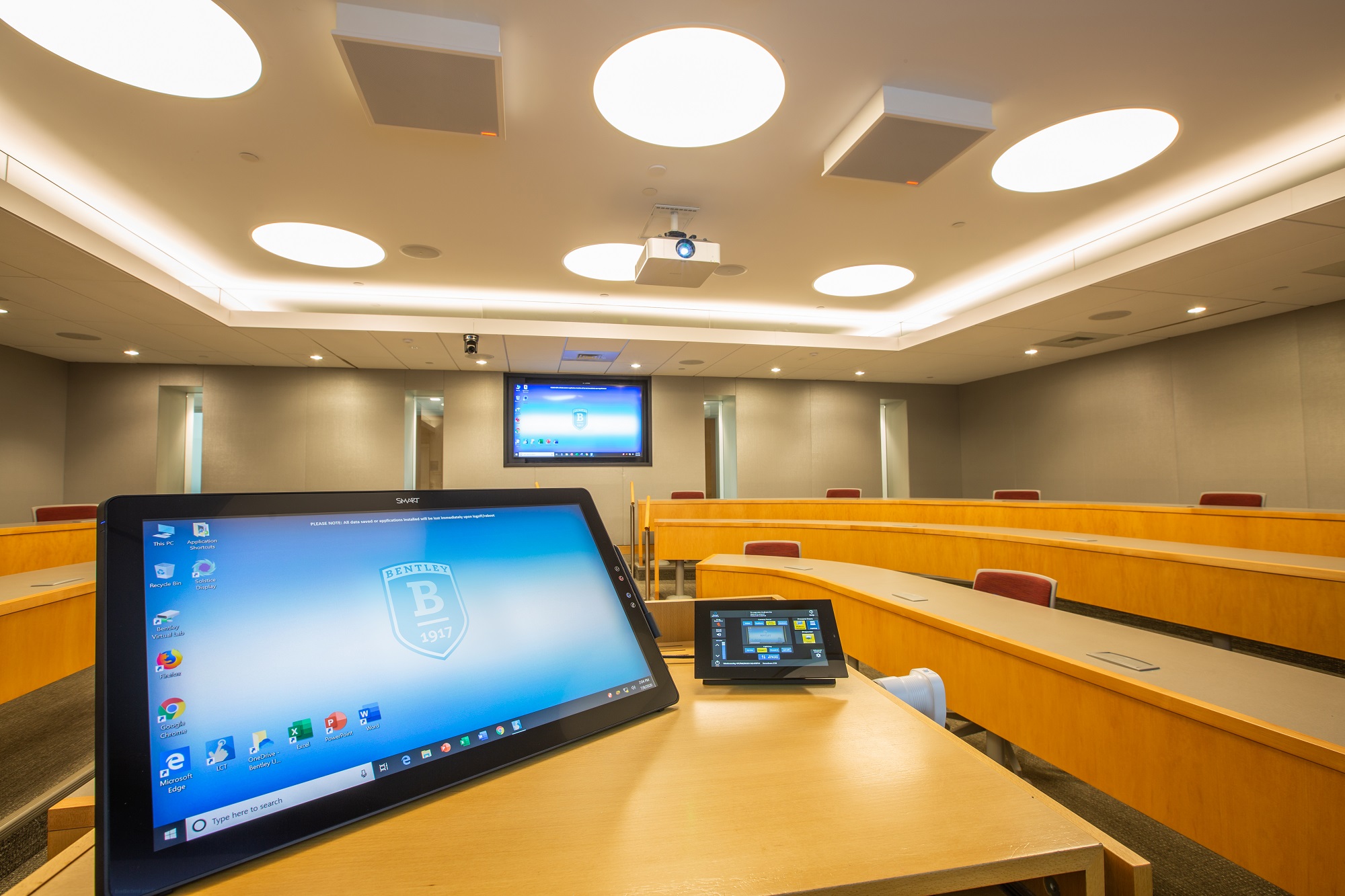 screen at podium in classroom