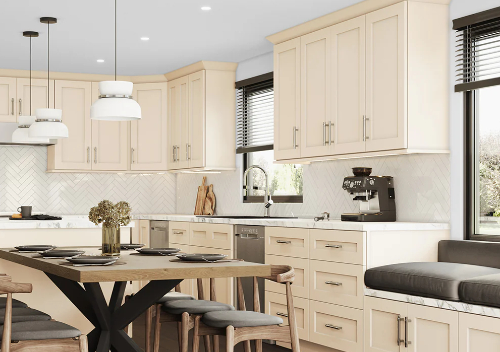 Modern kitchen with beige cabinetry, white herringbone tile backsplash, dark wood dining table with gray cushioned chairs, and espresso machine on countertop.