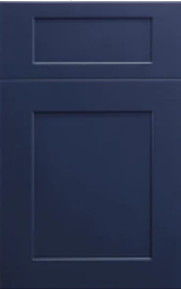 Close-up of a beige cabinet door with a rectangular panel and trim detailing.