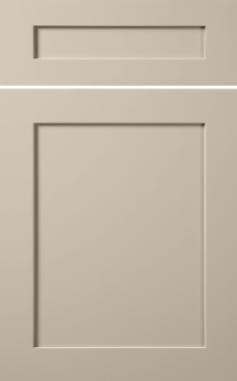 Grey door with two raised rectangular panels, one small horizontal near the top and one large vertical below it.