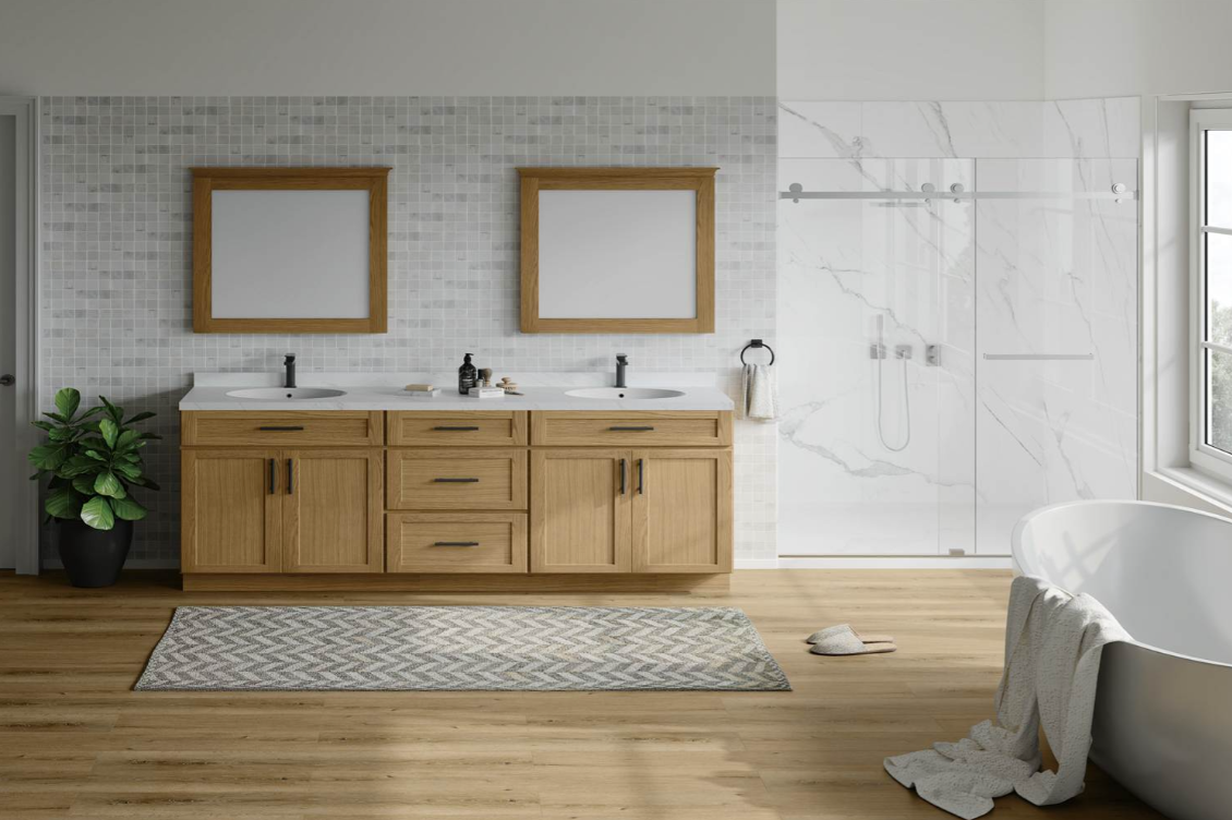 Gray kitchen cabinetry with a built-in wine rack holding three bottles and four hanging wine glasses above a stainless steel faucet and white countertop.