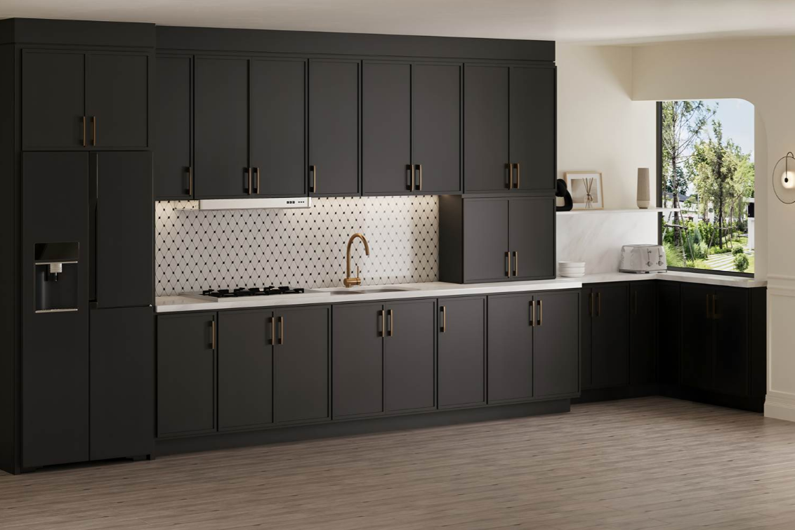 Modern kitchen corner with white cabinets and granite countertops, a double sink, and various kitchen items including a coffee maker and utensil holder.