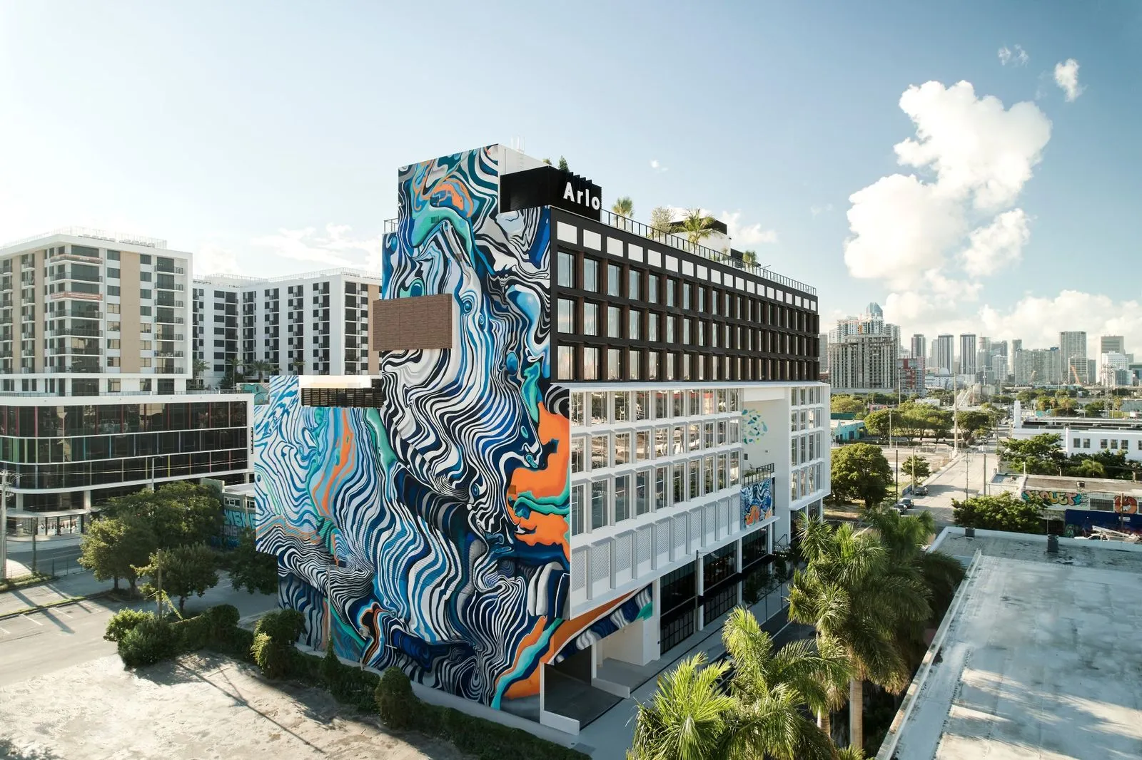 large custom mural on outside of miami hotel