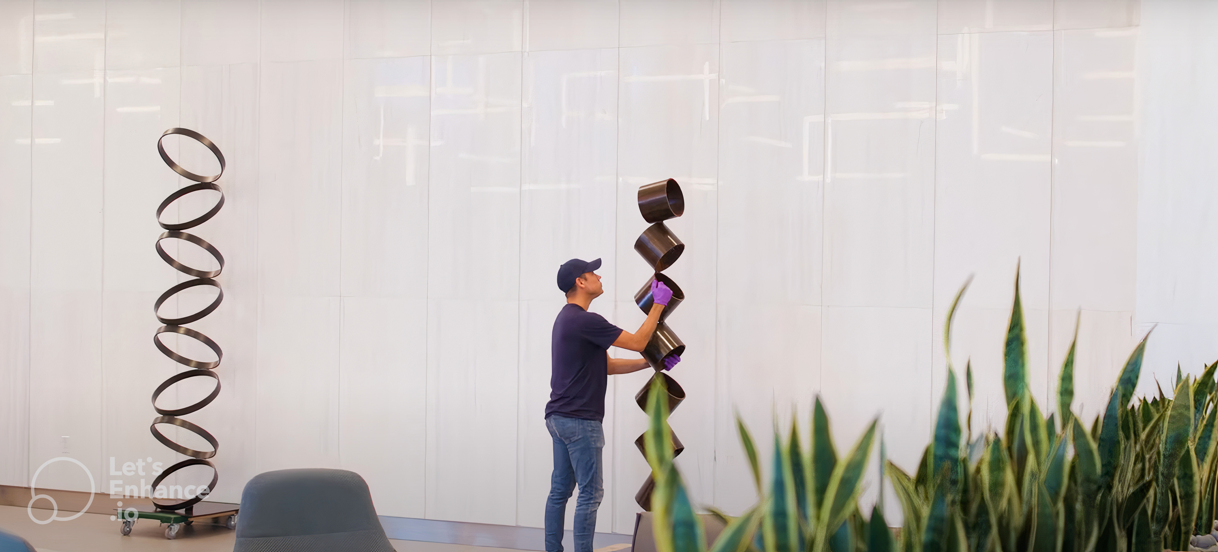 Digital interface of an artwork management platform showcasing the 'Artwork Highlights' section with Florida artist Ari Robinson and his artwork 'Ocean Breeze' in the curation options.