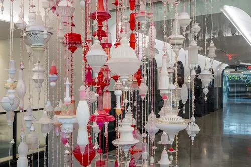 custom red and white hanging sculpture in stairwell of amazon office space