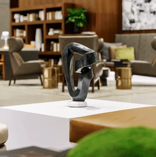 black sculpture on pedestal in hotel lobby