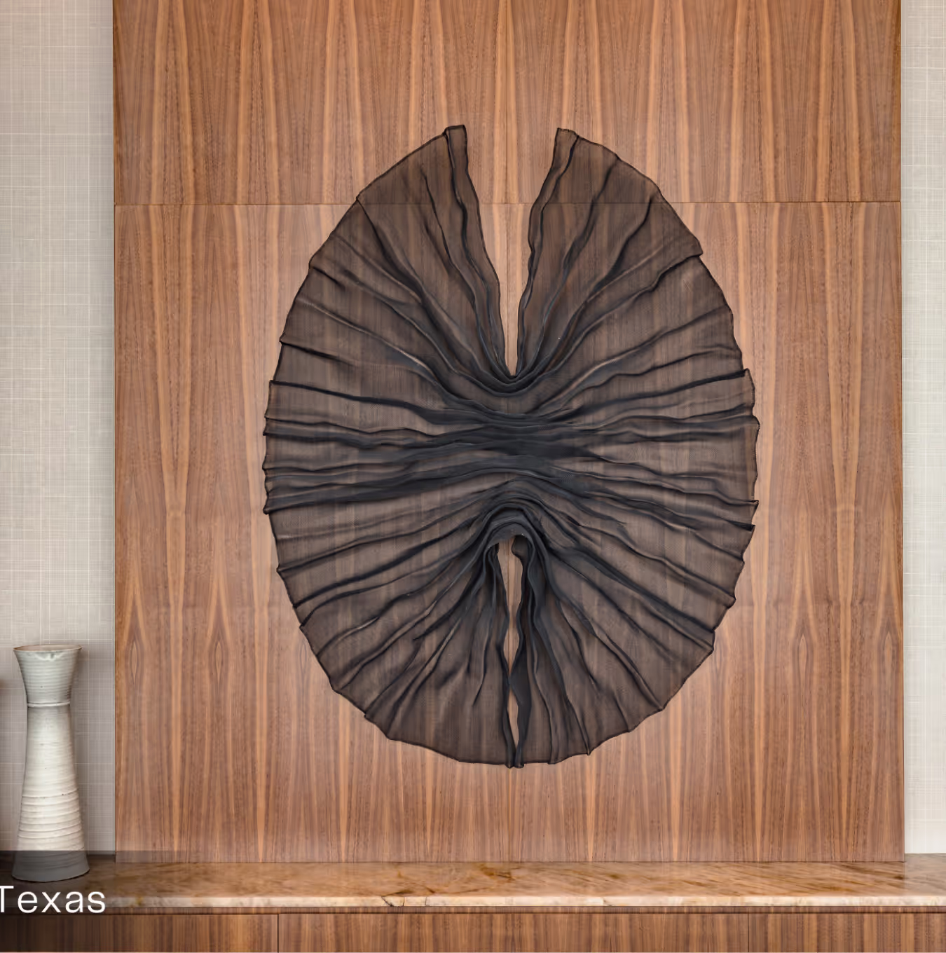 black wall sculpture on wood wall