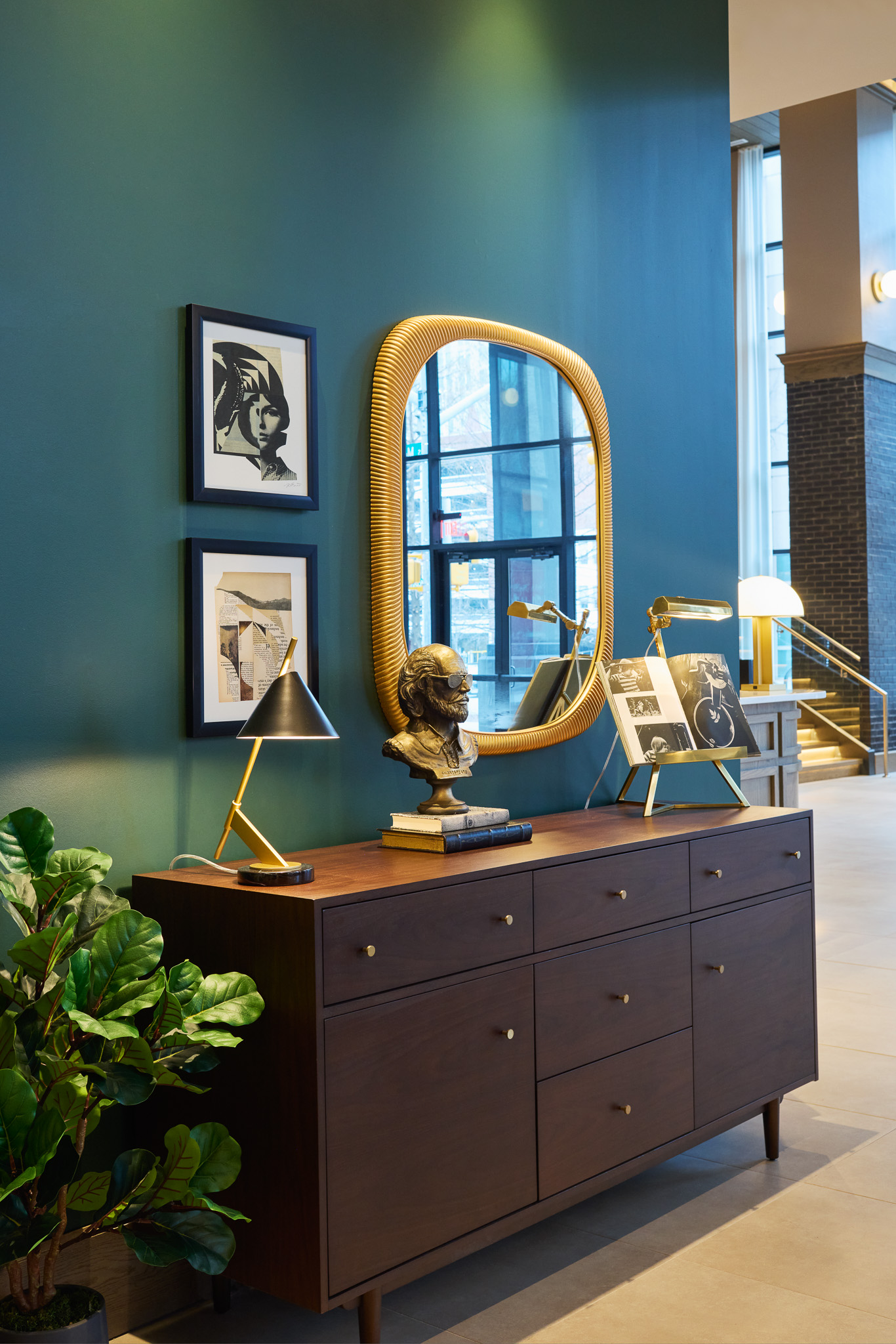 framed art prints and sir walter bust in raleigh hotel lobby