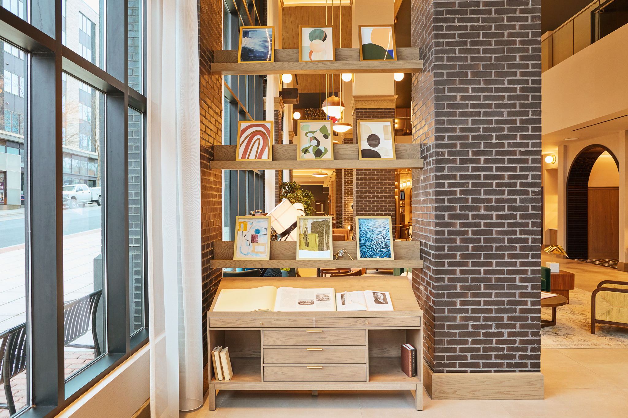 art collection in the lobby of tempo by hilton raleigh