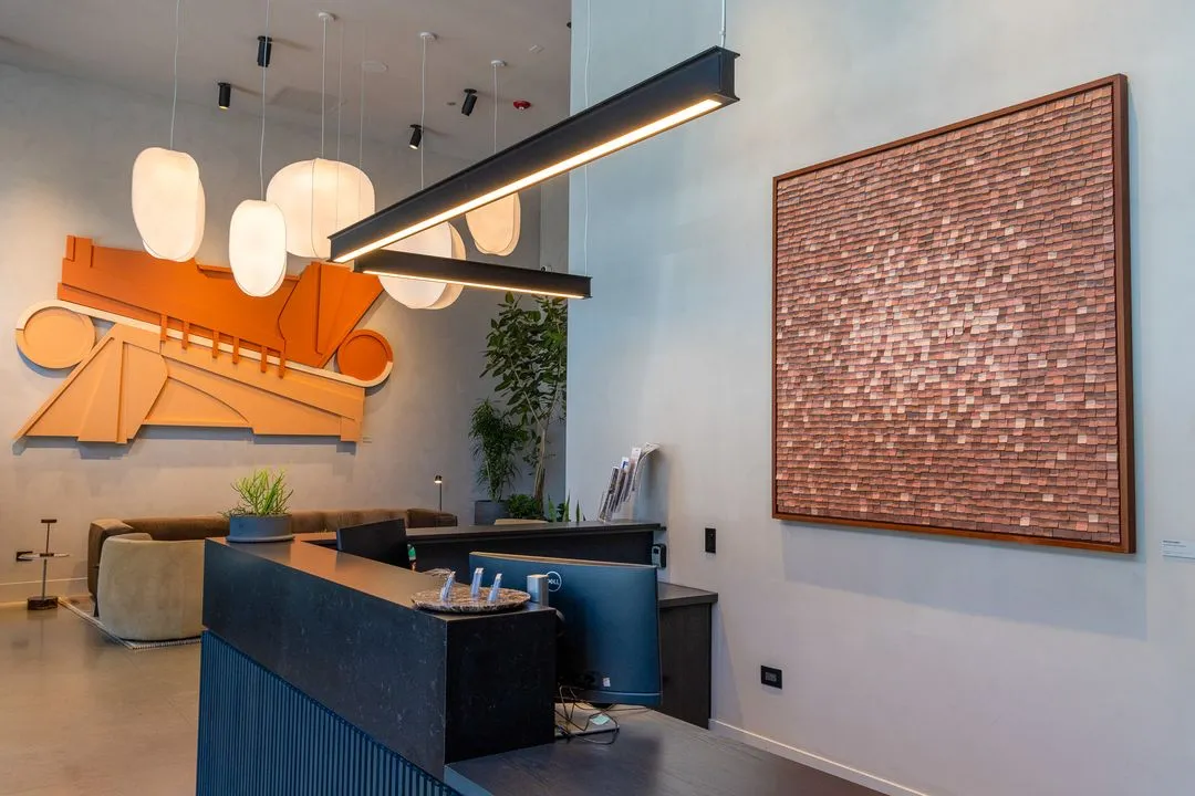 two orange and rust art pieces in multi family apartment lobby