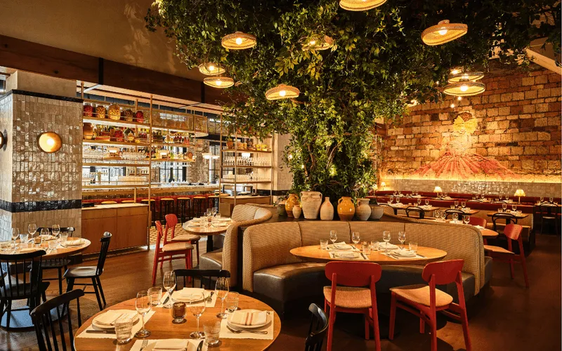 dinning room at bar primi with mural in background