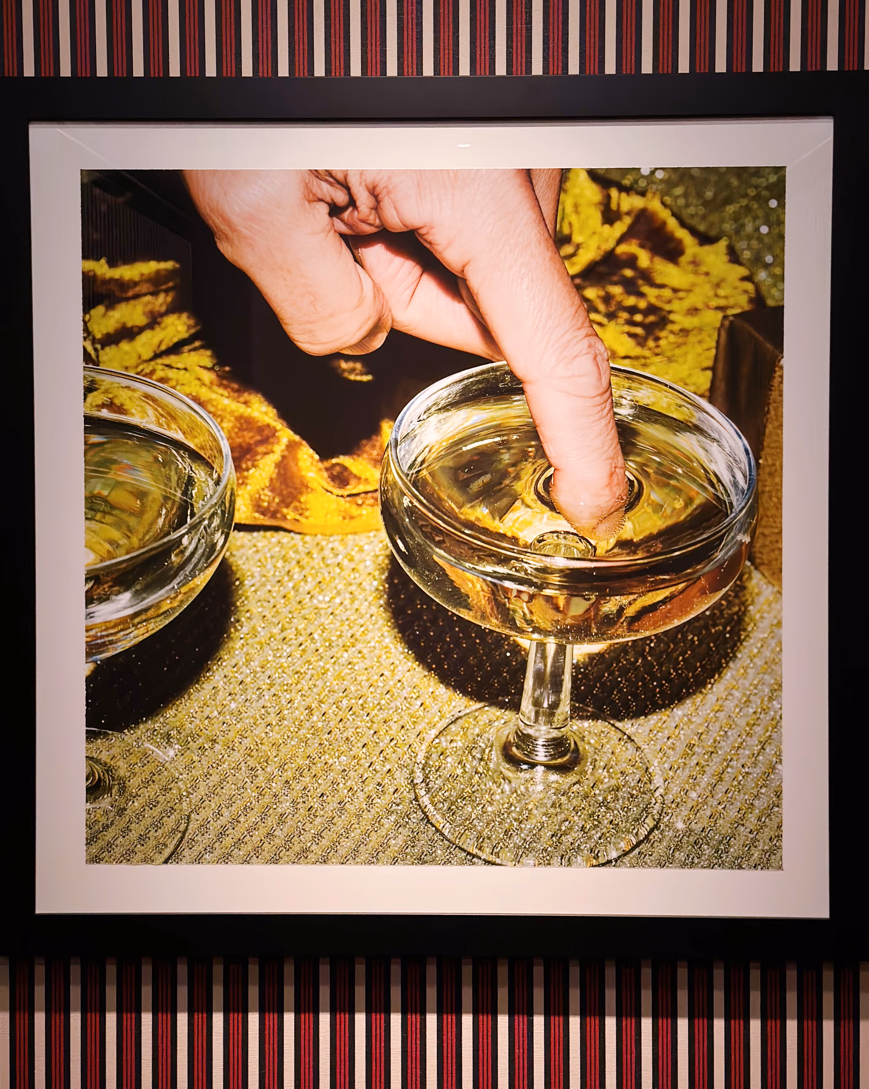photo of hand in a martini