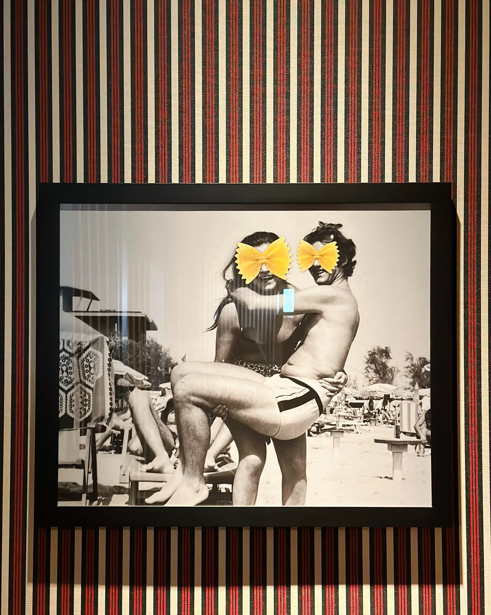 black and white photo of couple with yellow bow tie pasta for a face