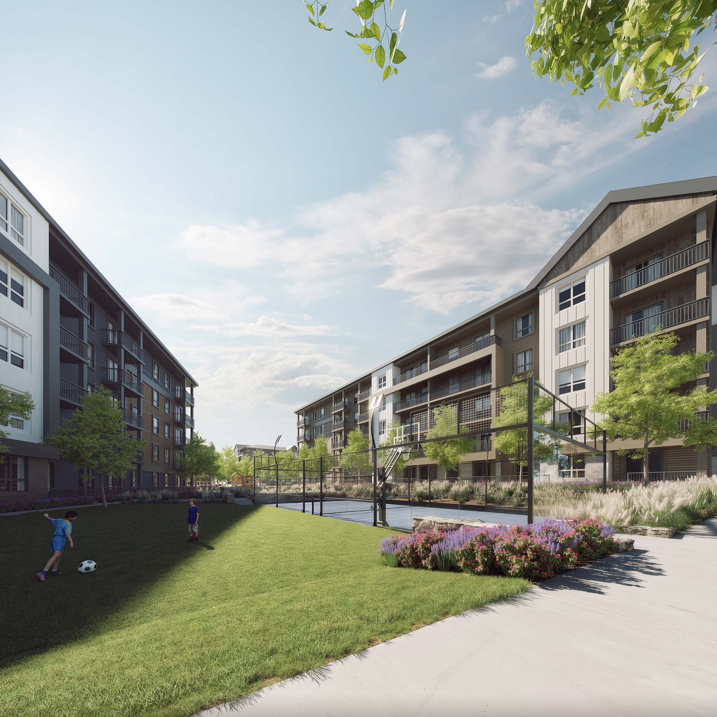 children playing in the green area beside the amenity sport court at township collective