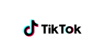 TikTok logo with multicolor neon outline on black background.
