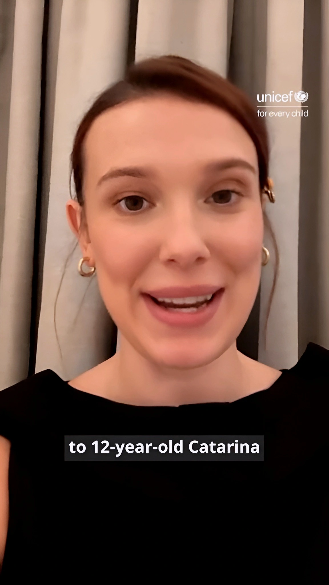 Millie Bobby Brown taking a selfie with young kids