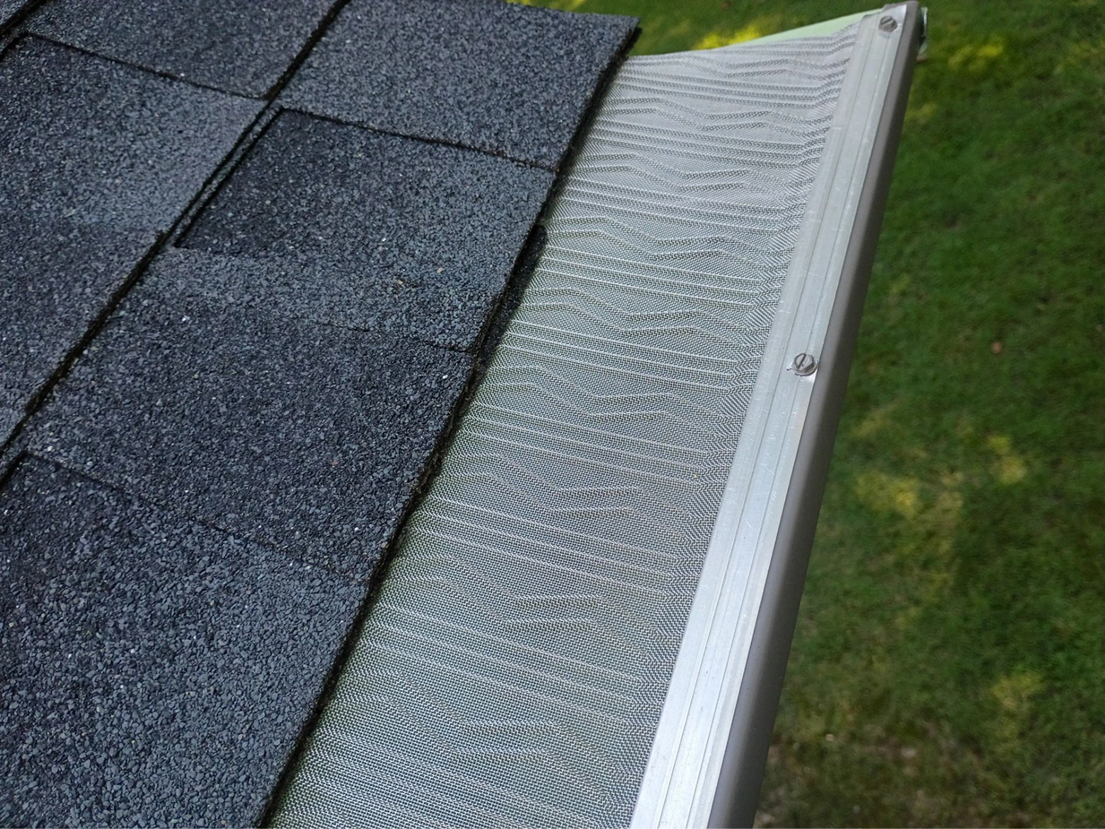 Seamless gutter installation along a residential roofline designed for clean appearance and effective rainwater drainage.