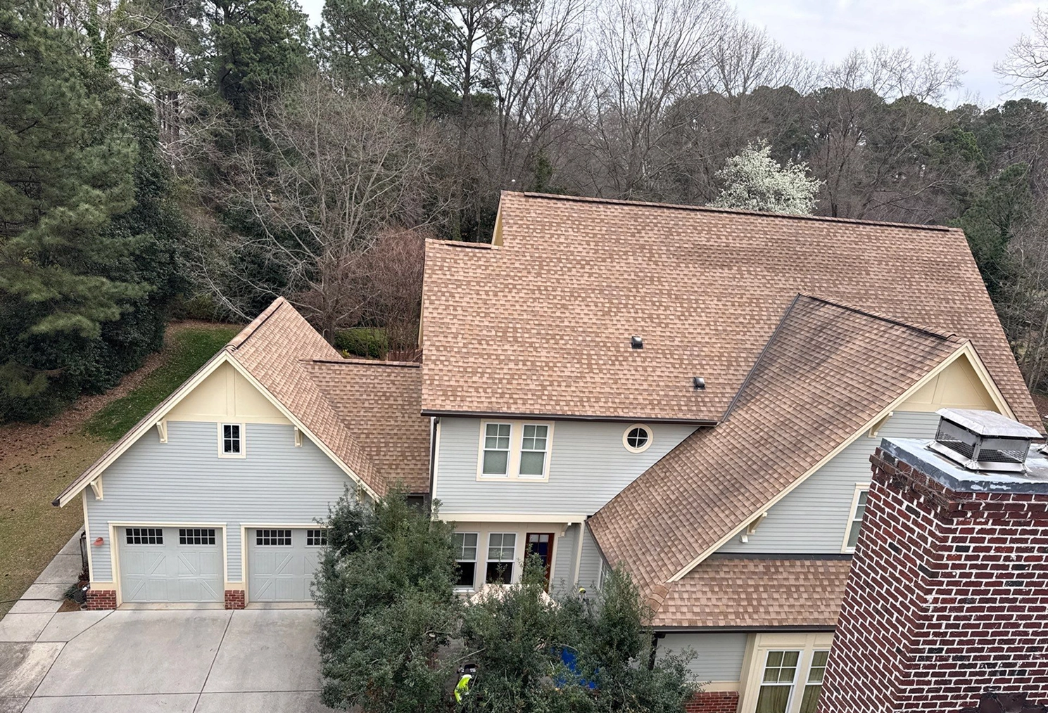 Completed roofing project on a single-family home, highlighting consistent shingle alignment, clean rooflines, and overall craftsmanship.