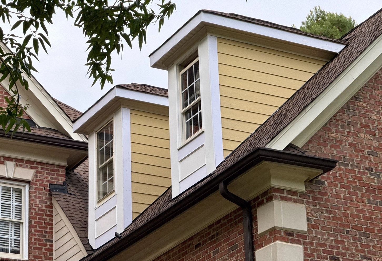 Residential exterior repair and trim work around dormers and rooflines