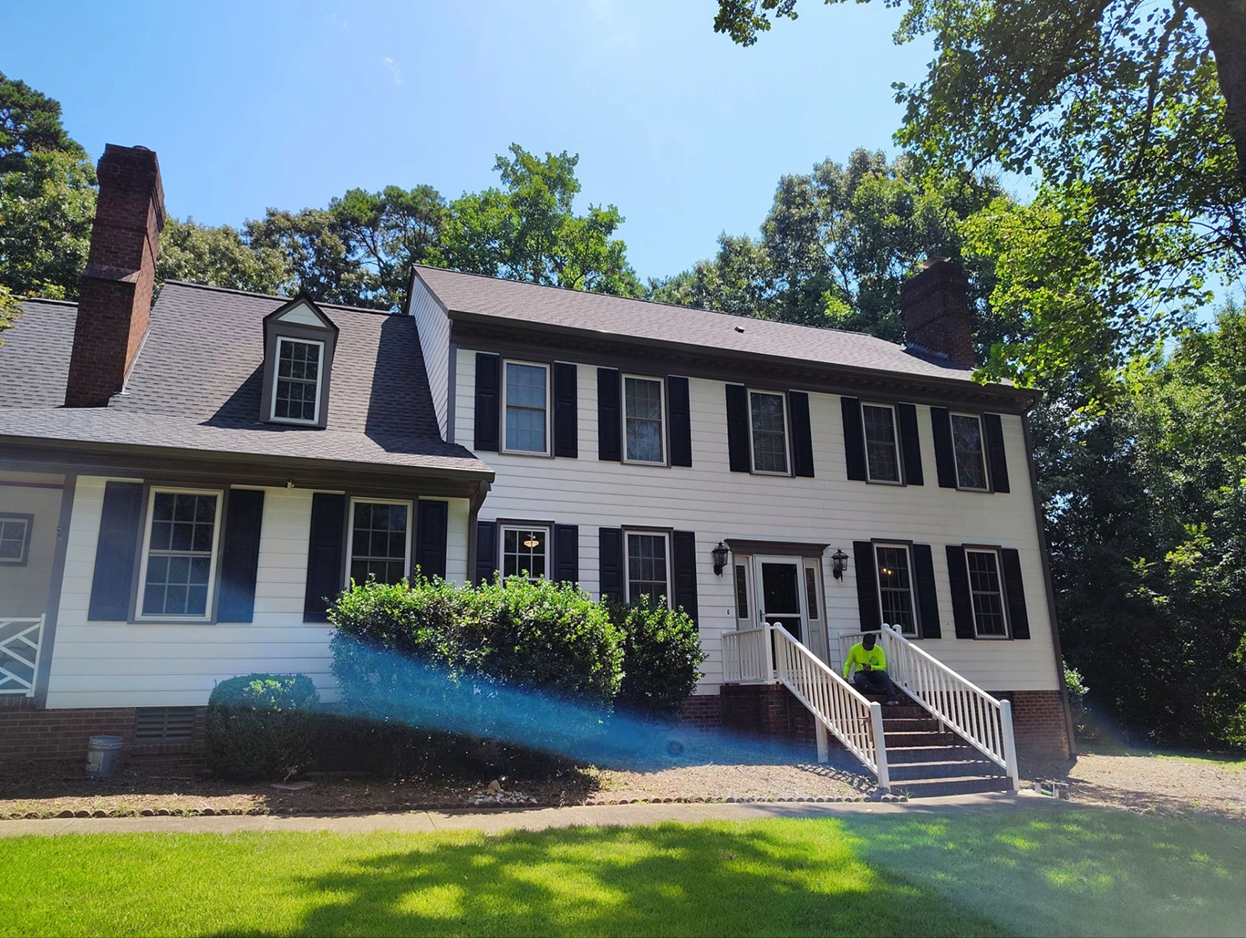 Updated exterior of a residential home with refreshed siding, trim, and overall appearance.