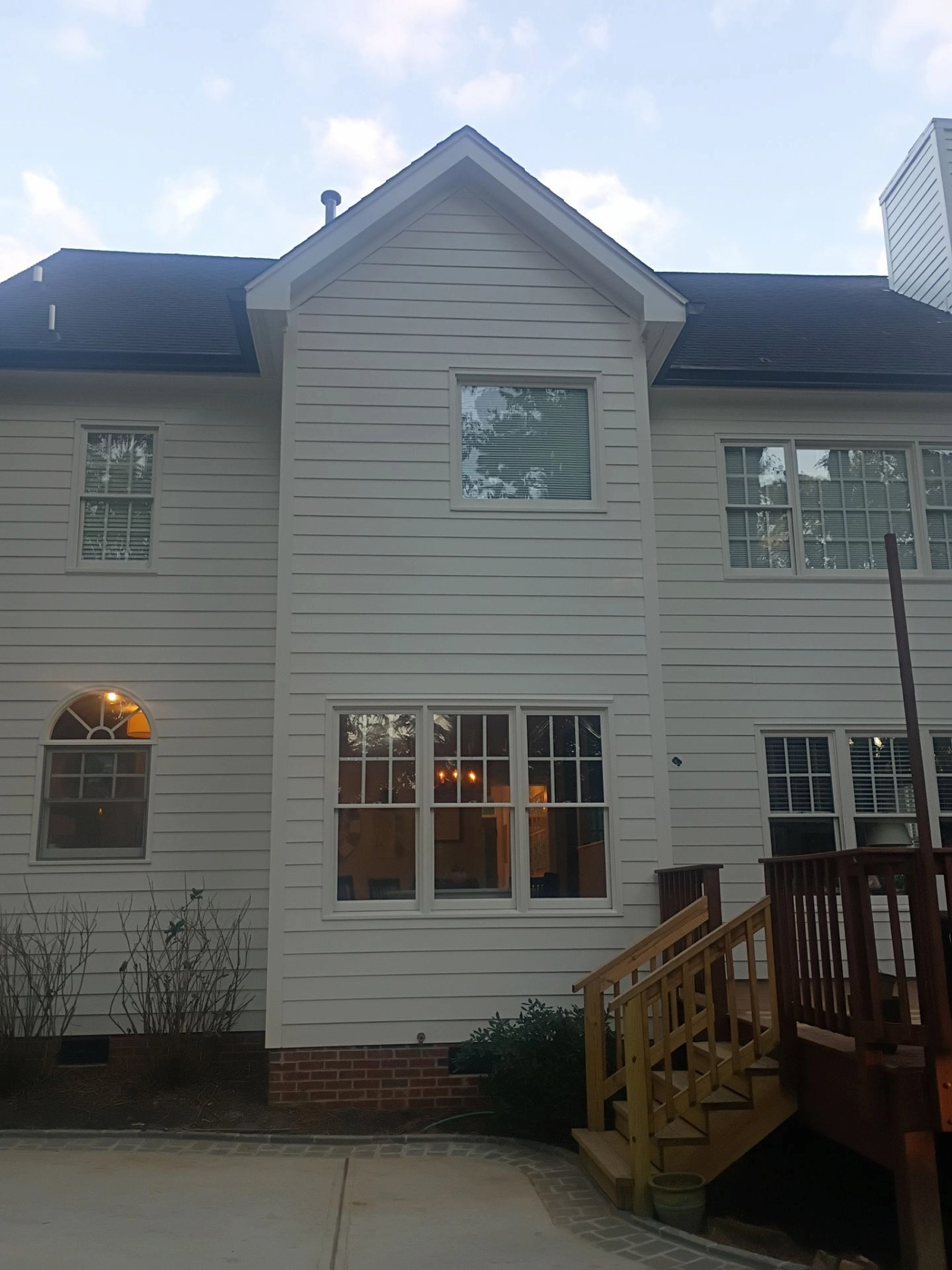 Exterior repair work improving the home’s siding and overall appearance.