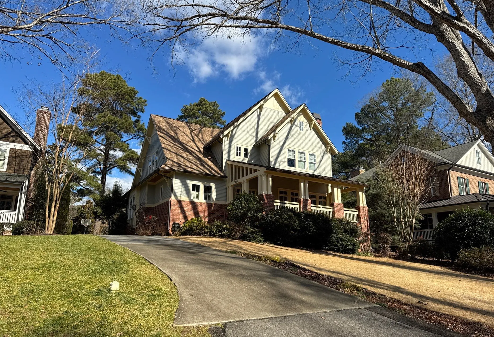 Exterior view of a two-story home with front porch and driveway.