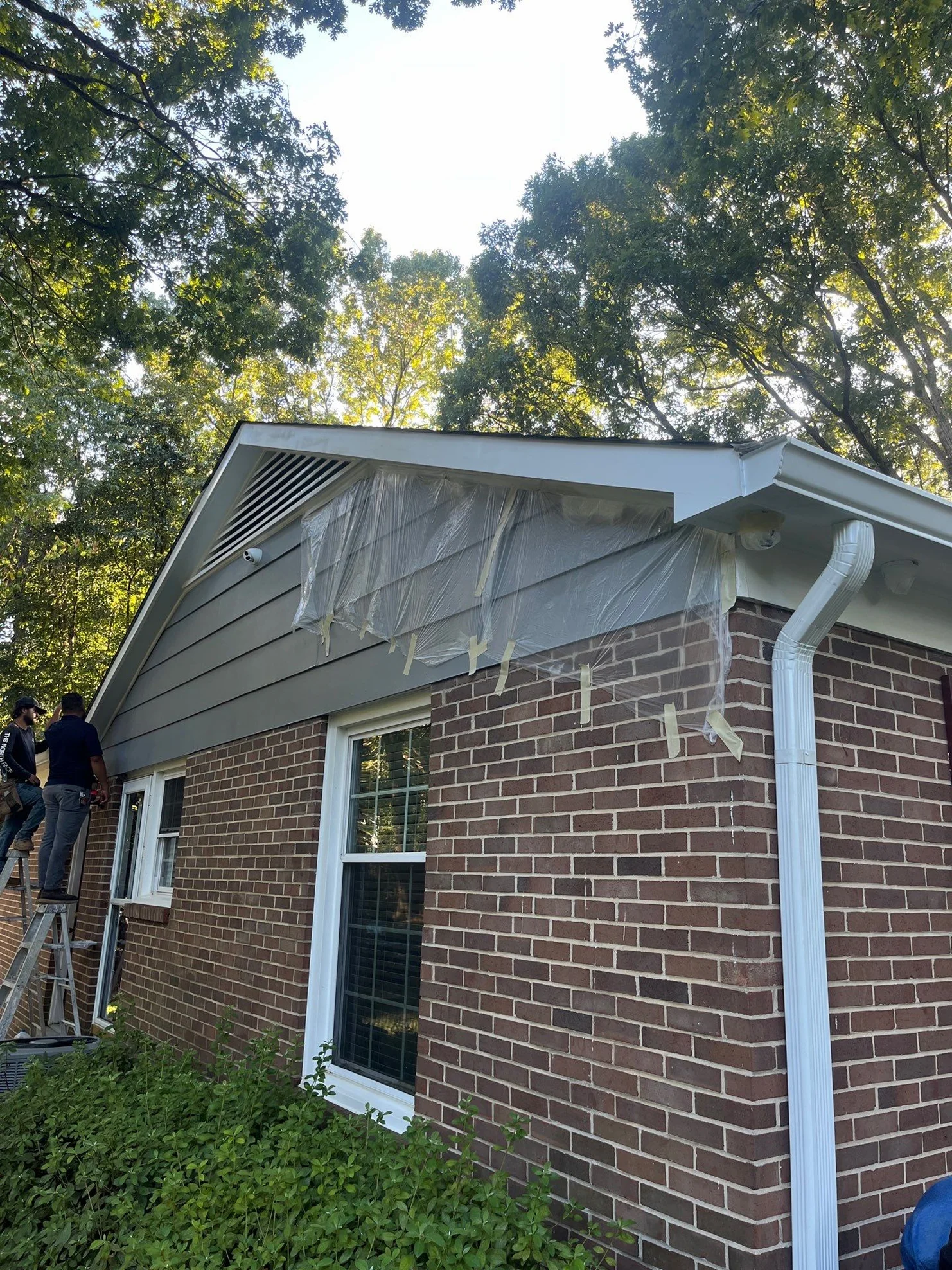 Ongoing exterior repair with protective masking in place