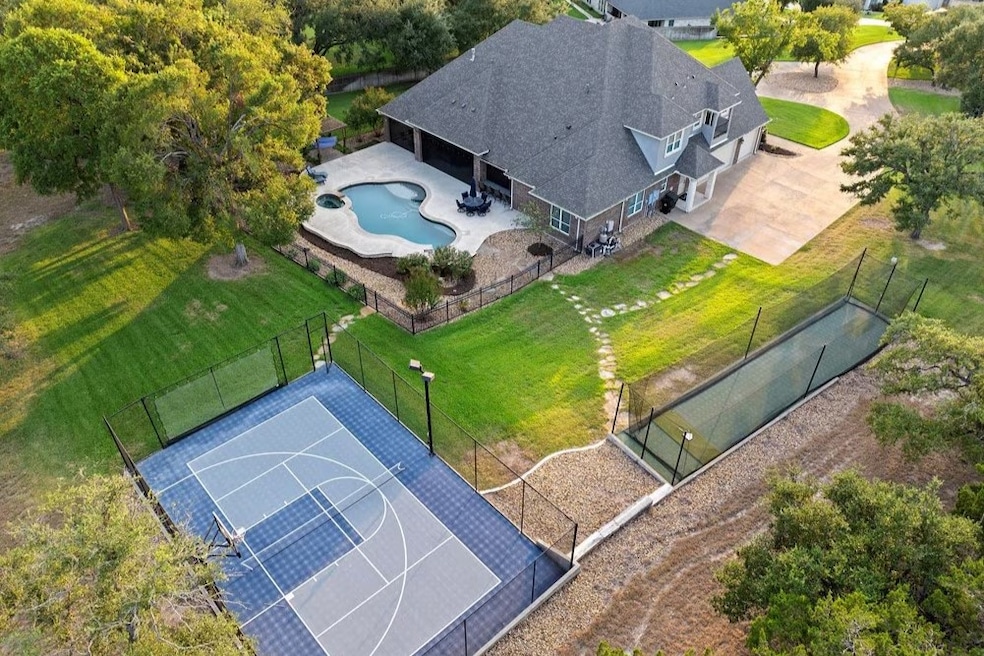 Outdoor features include a sports court, swimming pool and a batting cage. (Tim Kennedy/Magnolia Realty)