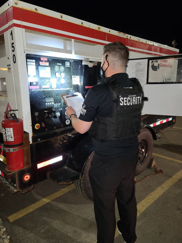 Uniformed Blackbird security guard standing in generator with clipboard