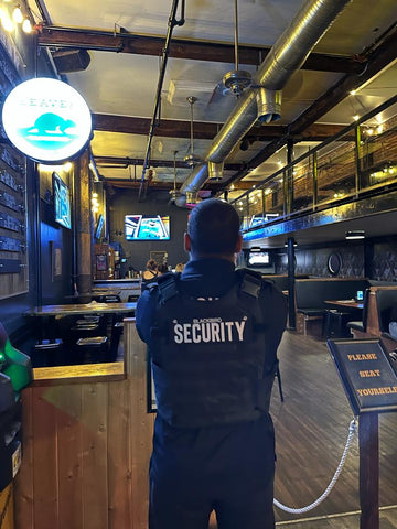 Blackbird security guard standing in front of bar at Samesun Hostel