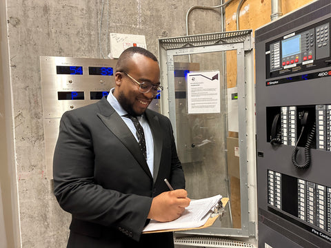Blackbird security guard with clipboard at control panel
