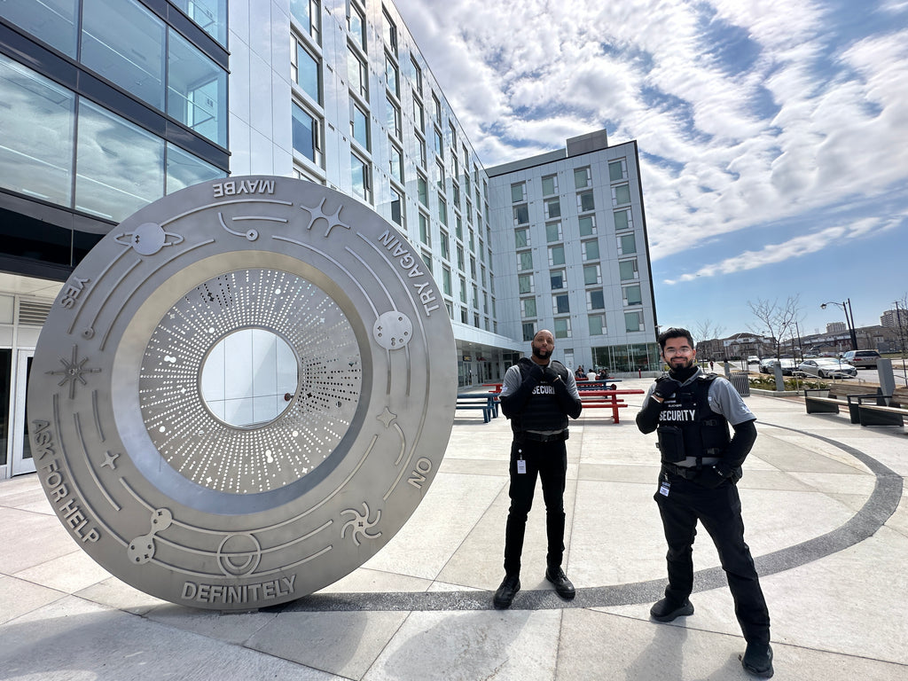 Two Uniformed Blackbird security guards in downtown urban location