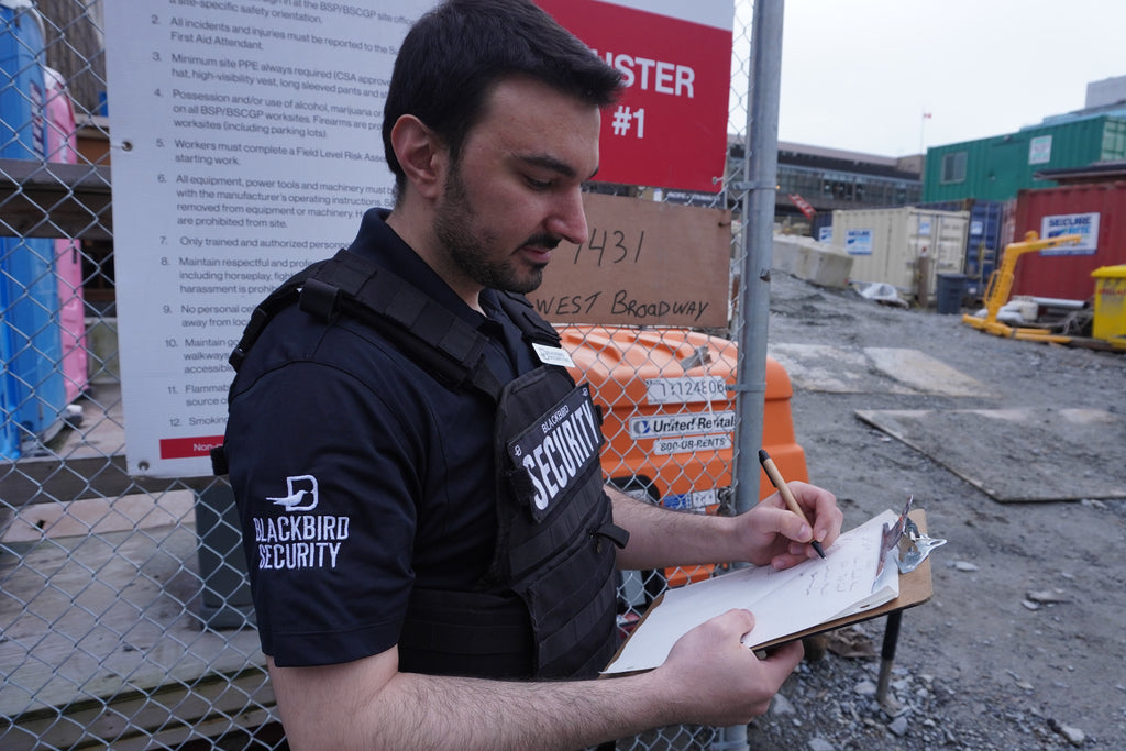 Security officer from Blackbird Security conducting a construction site report