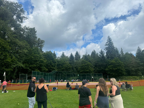 people standing in front of baseball diamond