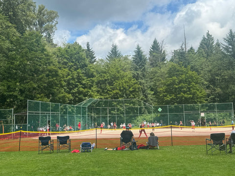 people playing baseball at diamond