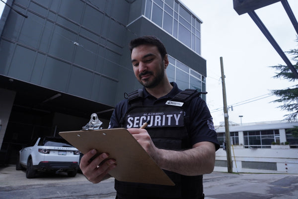 Blackbird Security construction site security guard with clipboard in hand