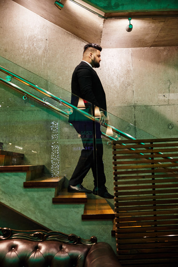 Plained Clothes Blackbird security guard walking down flight of stairs