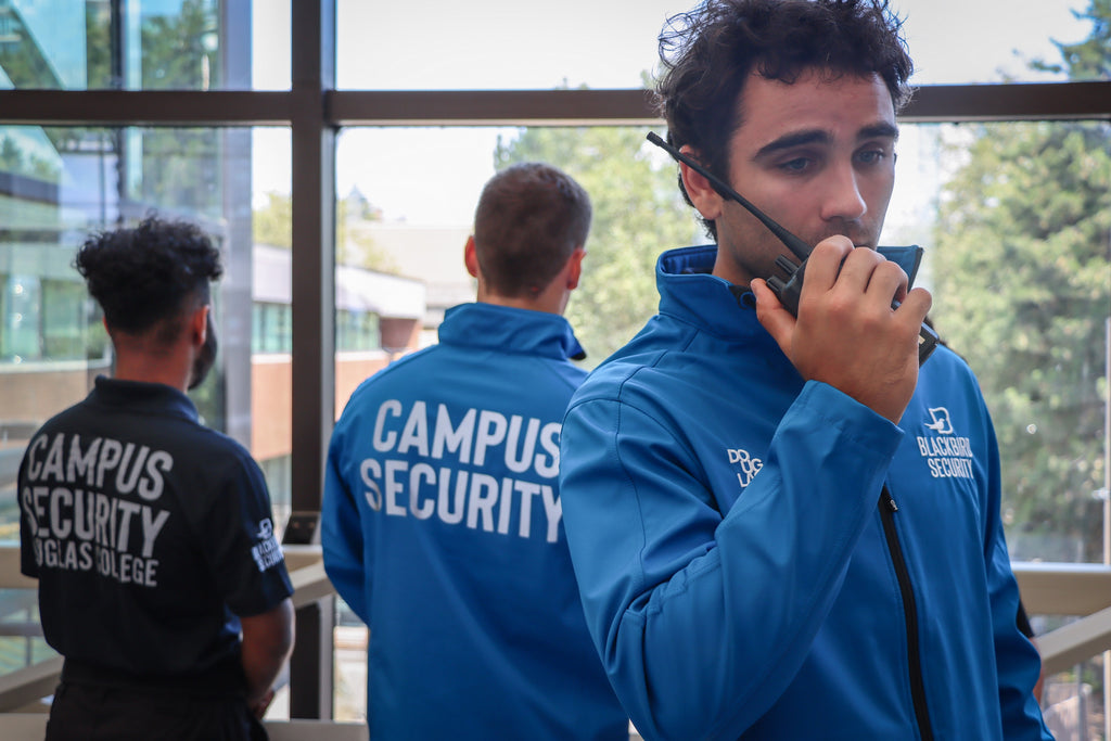 Blackbird security guard on radio with campus security