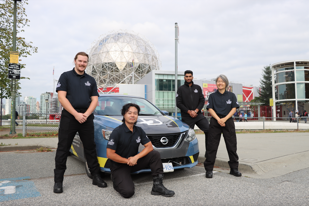 Four Blackbird security in front Mobile patrol car at BC Science Centre