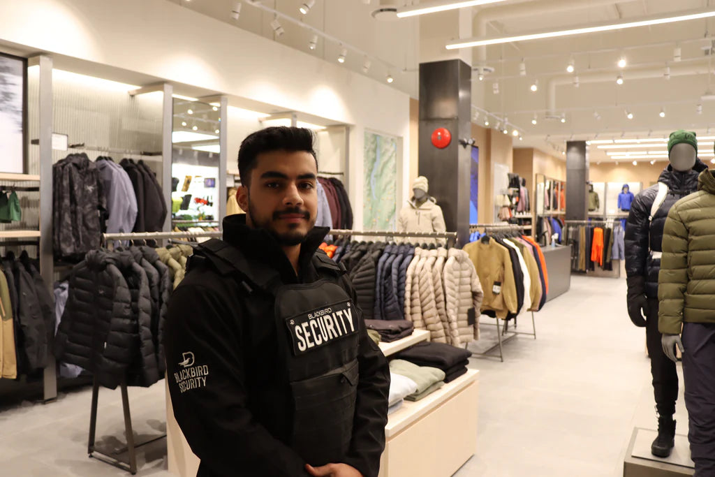 Retail security guard wearing a vest in a clothing store