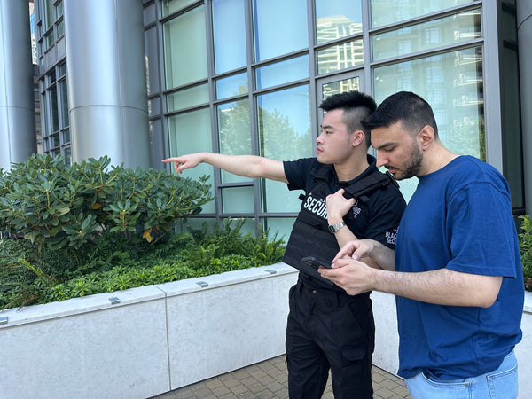 Blackbird security guard giving directions to man